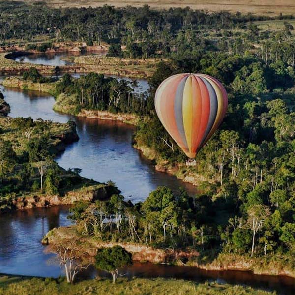 Serengeti hot air balloon safari at sunrise over wildlife plains
